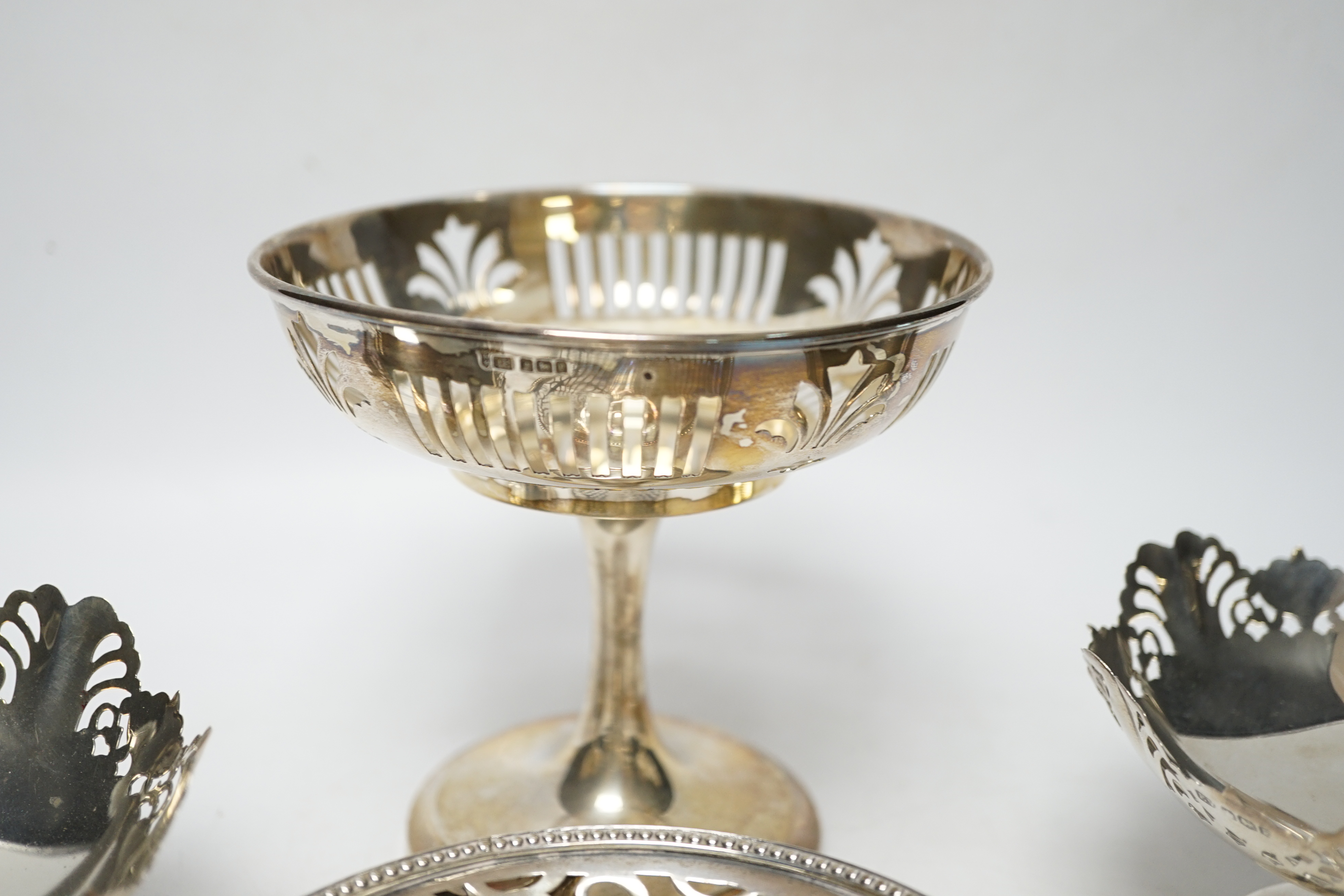 A pair of George VI pierced silver pedestal bon bon dishes, Viners Ltd, Sheffield, 1947, 11.7cm and three other assorted silver bonbon dishes, one with ring handles.